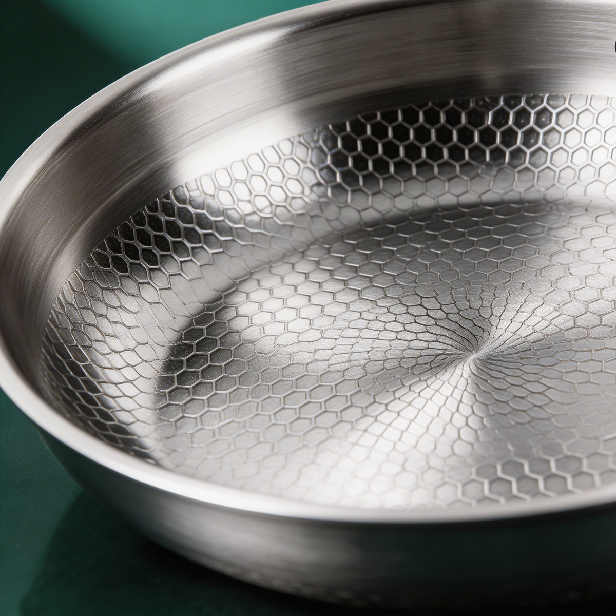 Close-up of hand-hammered titanium surface – Kakiya frying pan